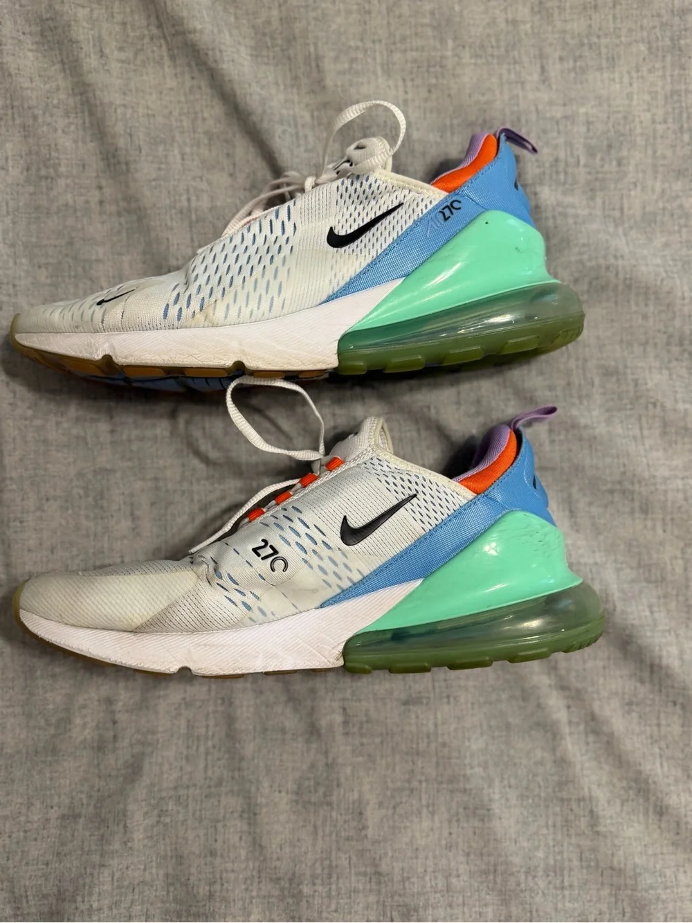 Nike White Running Sneakers with Orange Accents and Purple Lining